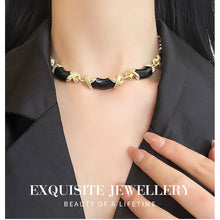 Load image into Gallery viewer, Black Onyx &amp; Gold X-Band Bracelet | Hypoallergenic Adjustable Jewelry for Women | Modern Luxury Minimalist Design