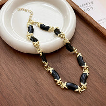 Load image into Gallery viewer, Black Onyx &amp; Gold X-Band Bracelet | Hypoallergenic Adjustable Jewelry for Women | Modern Luxury Minimalist Design